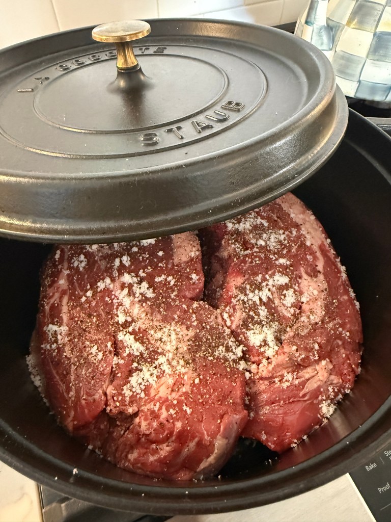 Chuck roast seasoned and ready to cook in a Staub Dutch oven.